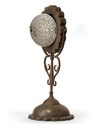 A GILT DECORATED METAL MIRROR HOLDER