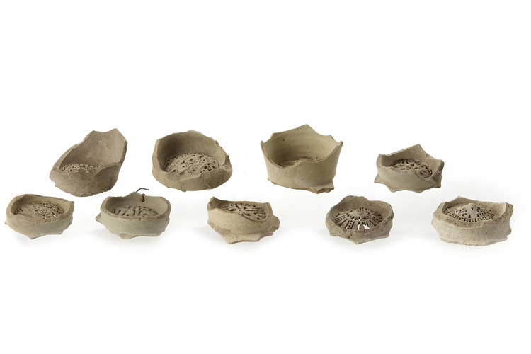 A GROUP OF NINE FATIMID UNGLAZED POTTERY WATER FILTERS, EGYPT, 10TH 11TH CENTURY