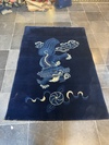 A CHINESE FOO DOG PEKING RUG, 1920