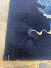 A CHINESE FOO DOG PEKING RUG, 1920