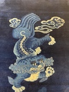 A CHINESE FOO DOG PEKING RUG, 1920