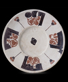 A RARE BICHROME CALLIGRAPHIC POTTERY DISH, NISHAPUR OR SAMARKAND, 10TH CENTURY
