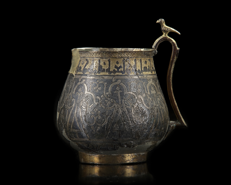 A VERY RARE AND IMPORTANT EARLY ISLAMIC PARCEL-GILT CUP