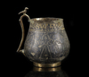 A VERY RARE AND IMPORTANT EARLY ISLAMIC PARCEL-GILT CUP