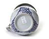 A JAPANESE BLUE AND WHITE JUG WITH SILVER COVER, 17TH CENTURY