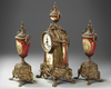 A SPELTER AND RED PORCELAIN CLOCK SET, 19TH CENTURY
