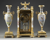 A FRENCH ORMOLU AND PORCELAIN CLOCK GARNITURE, 19TH CENTURY