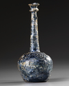 A TALL-NECKED BLUE GLASS BOTTLE, PERSIA OR SYRIA, 11TH-12TH CENTURY