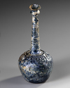 A TALL-NECKED BLUE GLASS BOTTLE, PERSIA OR SYRIA, 11TH-12TH CENTURY