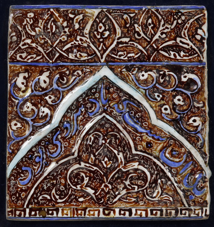 AN ILKHANID COBALT-BLUE, TURQUOISE AND LUSTRE MOULDED POTTERY TILE, IRAN, LATE 13TH-EARLY 14TH CENTURY