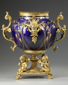 A FRENCH GILT SPELTER AND BLUE PORCELAIN FLOWER POT,  LATE 19TH CENTURY