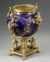A FRENCH GILT SPELTER AND BLUE PORCELAIN FLOWER POT,  LATE 19TH CENTURY