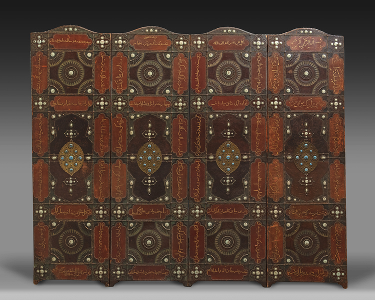 A FOUR PANEL LEATHER SCREEN, DATED 1346 AH /1927-28 AD