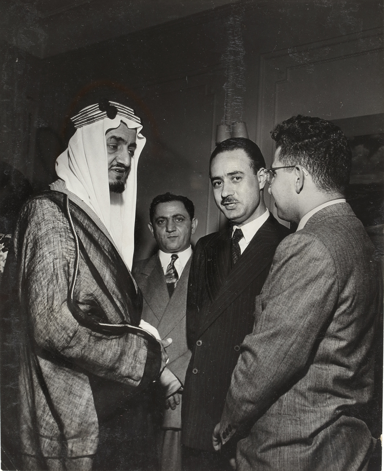 FOUR PICTURES OF KING FAISAL WITH THE IRAQI DELEGATION