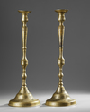 A PAIR OF LARGE QAJAR ENGRAVED BRASS CANDLESTICKS, IRAN, 19TH CENTURY