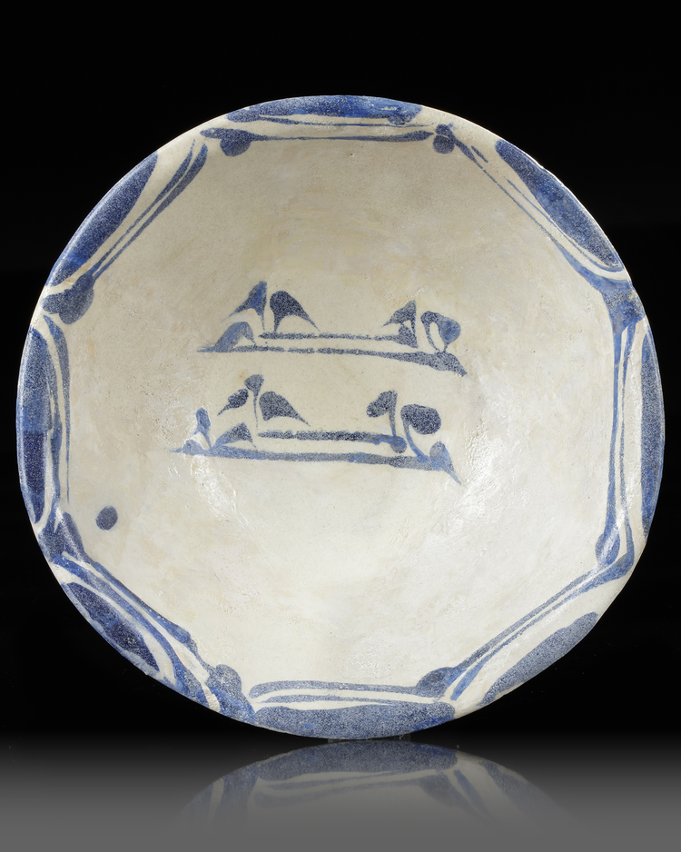 A FINE ABBASID POTTERY BOWL WITH KUFIC INCRIPTION, IRAQ, 9TH CENTURY