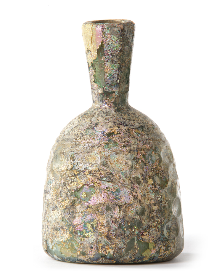 A HONEYCOMB FACETED WHEEL-CUT GLASS BOTTLE, PERSIA, CIRCA 10TH CENTURY