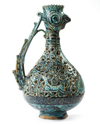 A RARE FRITWARE OPENWORK DECORATED RETICULATED EWER WITH ROOSTER HEAD, PERSIA, 13TH CENTURY