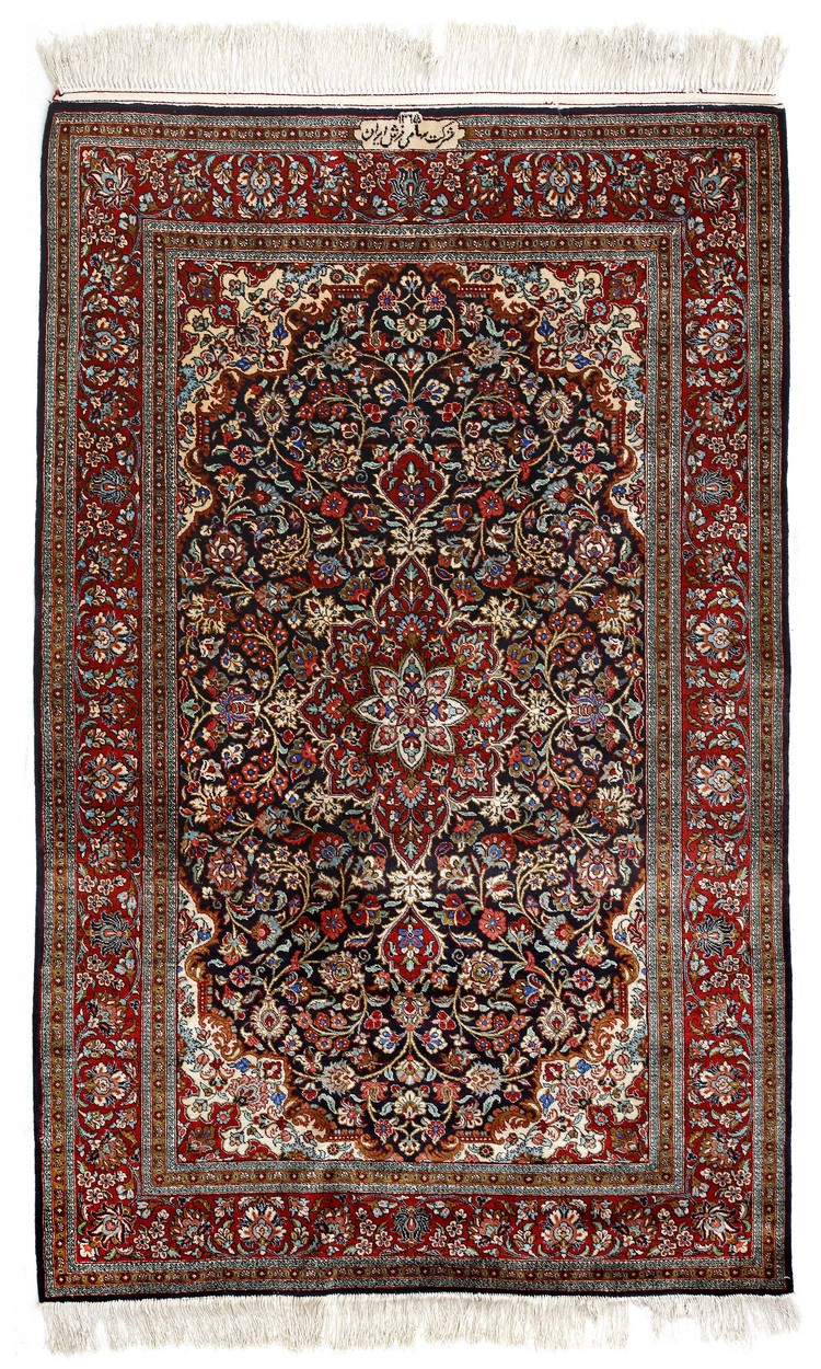 A FINE SILK KASHAN RUG