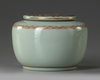 A CHINESE CELADON GLAZED DECORATED DRAGON' WATERPOT WITH COVER