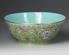 A  LARGE FAMILLE ROSE GREEN-GROUND BOWL DAOGUANG SIX-CHARACTER SEAL MARKS IN IRON RED AND OF THE PERIOD (1821-1850)