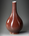 A CHINESE RED-GLAZED PEAR-SHAPED VASE, QIANLONG SEAL MARK IN UNDERGLAZE BLUE