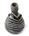 AN ELEGANT AYYUBID OR EARLY MAMLUK MARVERED GLASS JAR, EGYPT OR SYRIA, 12TH-13TH CENTURY