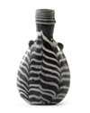 AN ELEGANT AYYUBID OR EARLY MAMLUK MARVERED GLASS JAR, EGYPT OR SYRIA, 12TH-13TH CENTURY