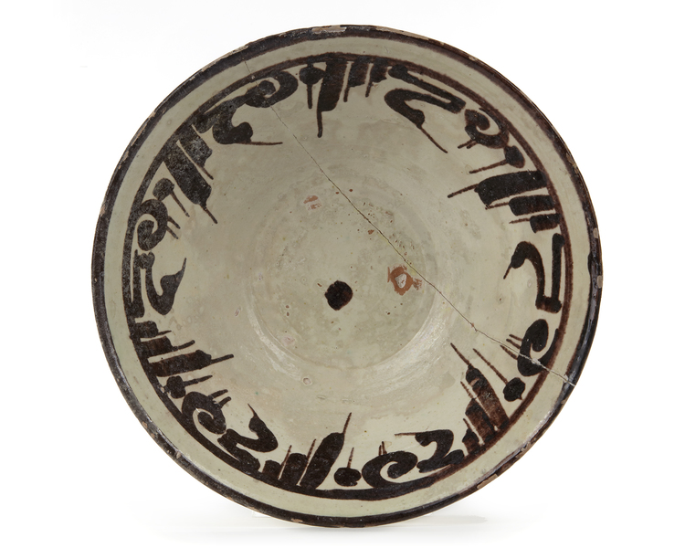 AN ISLAMIC NISHAPUR CALLIGRAPHIC POTTERY BOWL, EASTERN PERSIA, 10TH CENTURY