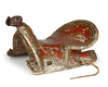 A POLYCHROME-PAINTED AND LACQUERED WOODEN SADDLE, CENTRAL ASIA, LATE 19TH CENTURY
