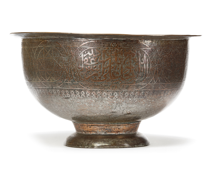 A MONUMENTAL EARLY TINNED COPPER BRASS BASIN, LATE 15TH-EARLY 16TH CENTURY AND LATER