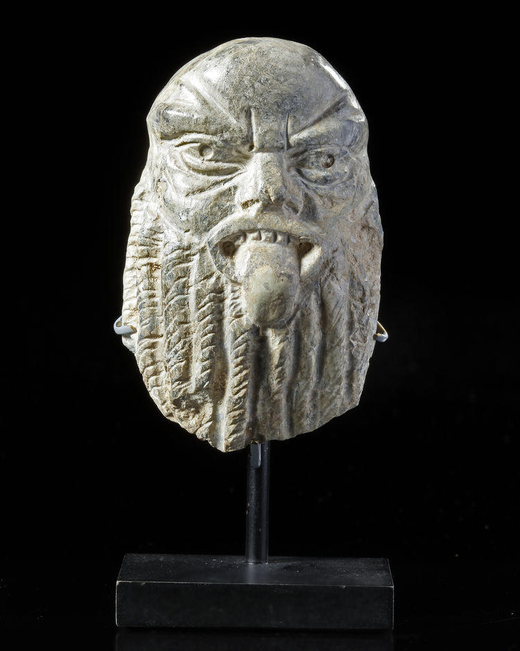 A SMALL STONE CARVED HEAD OF BES
