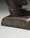 A bronze figure of a Lama
