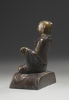 A bronze figure of a Lama