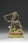 A gilt bronze figure of Manjusri