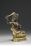 A gilt bronze figure of Manjusri