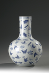 A large blue and white butterfly vase