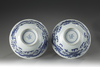 A pair of blue and white 'dragon and phoenix' bowls