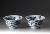 A pair of blue and white 'dragon and phoenix' bowls