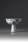 A blue and white stem cup