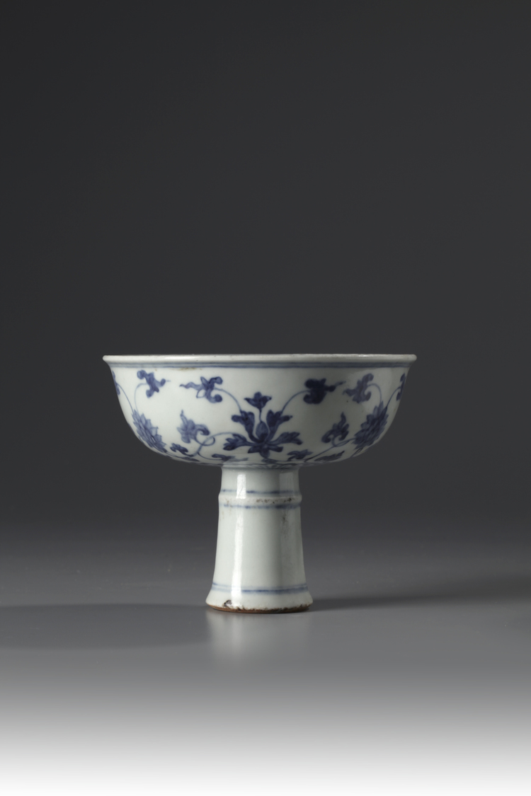 A blue and white stem cup