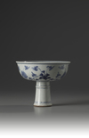 A blue and white stem cup