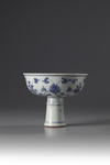 A blue and white stem cup