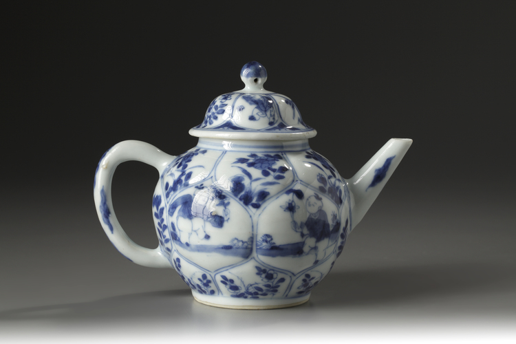 A blue and white moulded 'boys' teapot