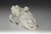 An agate sculpture of a horse and monkey