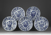 Five blue and white moulded plates