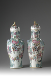 A pair of large Chinese famille rose baluster vases and covers