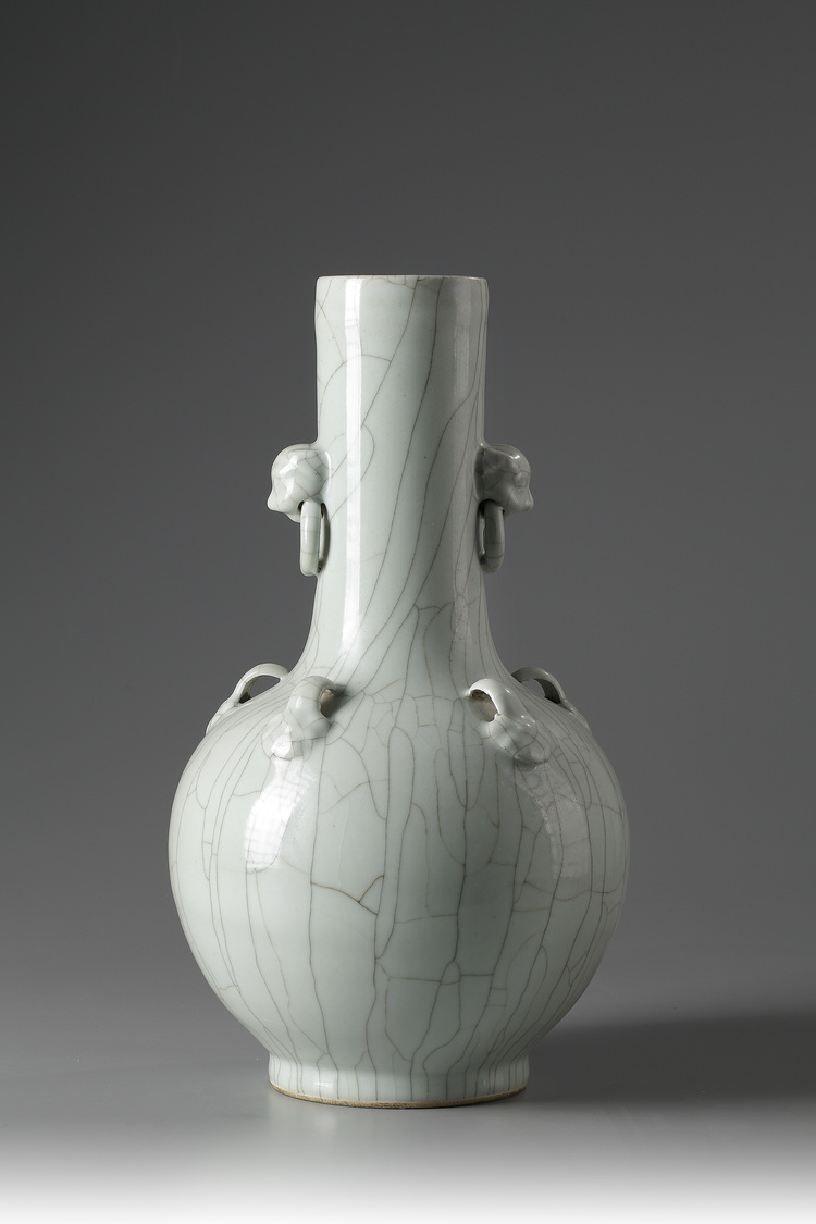 A large pale turquoise crackle-glazed bottle vase