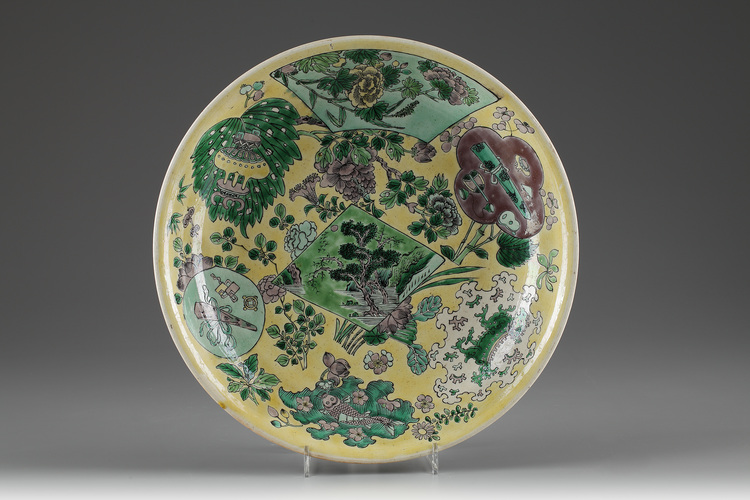 A yellow-ground green and aubergine-decorated biscuit plate