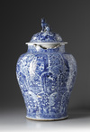A large blue and white jar with cover
